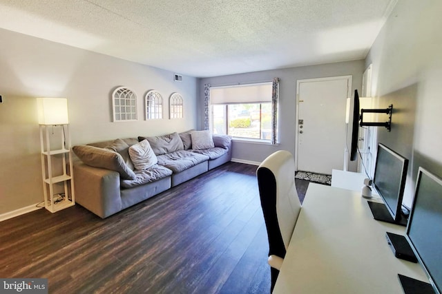 5200 Hilltop Dr Unit A2, Brookhaven, PA 19015 - living area featuring dark wood-style floors and a textured ceiling