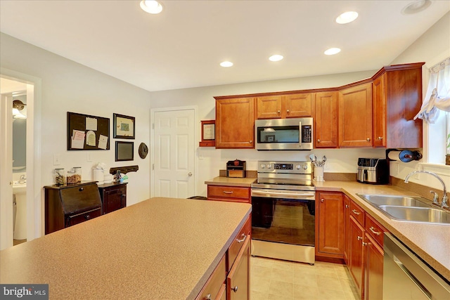 64 S 3rd St, New Freedom, PA 17349 - kitchen with stainless steel appliances, recessed lighting, light countertops, brown cabinets, and light tile patterned flooring
