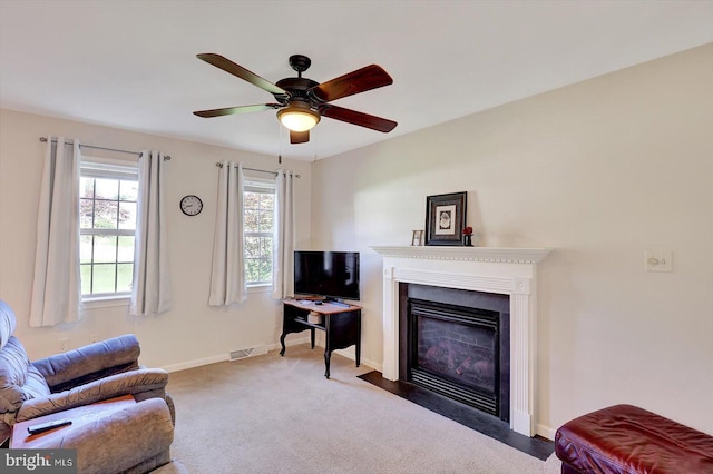64 S 3rd St, New Freedom, PA 17349 - living area featuring ceiling fan, a fireplace with flush hearth, and carpet