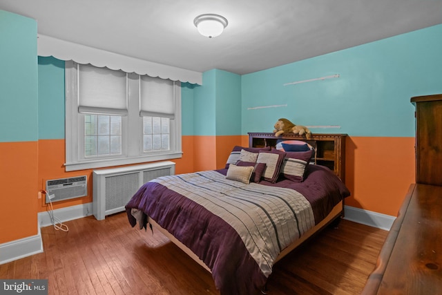 613 Arbor Rd, Cheltenham, PA 19012 - bedroom featuring radiator, hardwood / wood-style flooring, and a wall mounted air conditioner