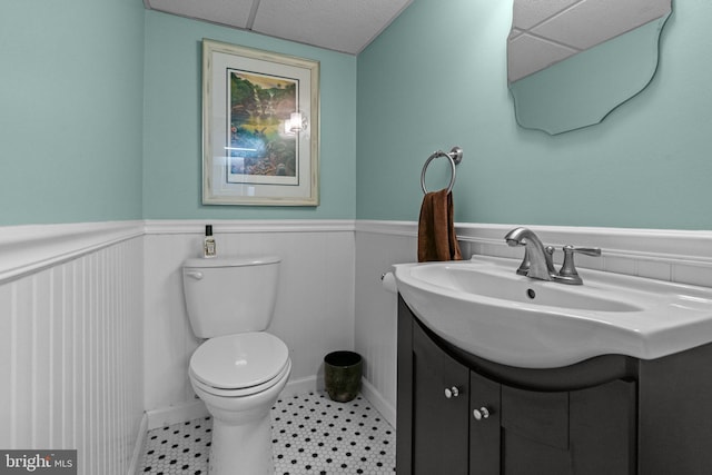 613 Arbor Rd, Cheltenham, PA 19012 - bathroom with vanity, wainscoting, and a paneled ceiling