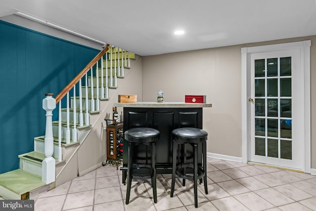 613 Arbor Rd, Cheltenham, PA 19012 - indoor dry bar with stairway, tile patterned flooring, and recessed lighting