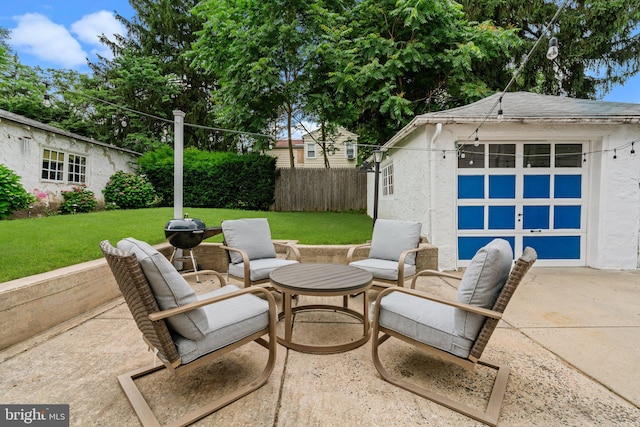 613 Arbor Rd, Cheltenham, PA 19012 - view of patio featuring an outdoor structure, concrete driveway, and a garage