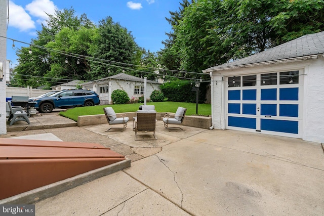 613 Arbor Rd, Cheltenham, PA 19012 - view of patio / terrace with driveway, a garage, and an outbuilding