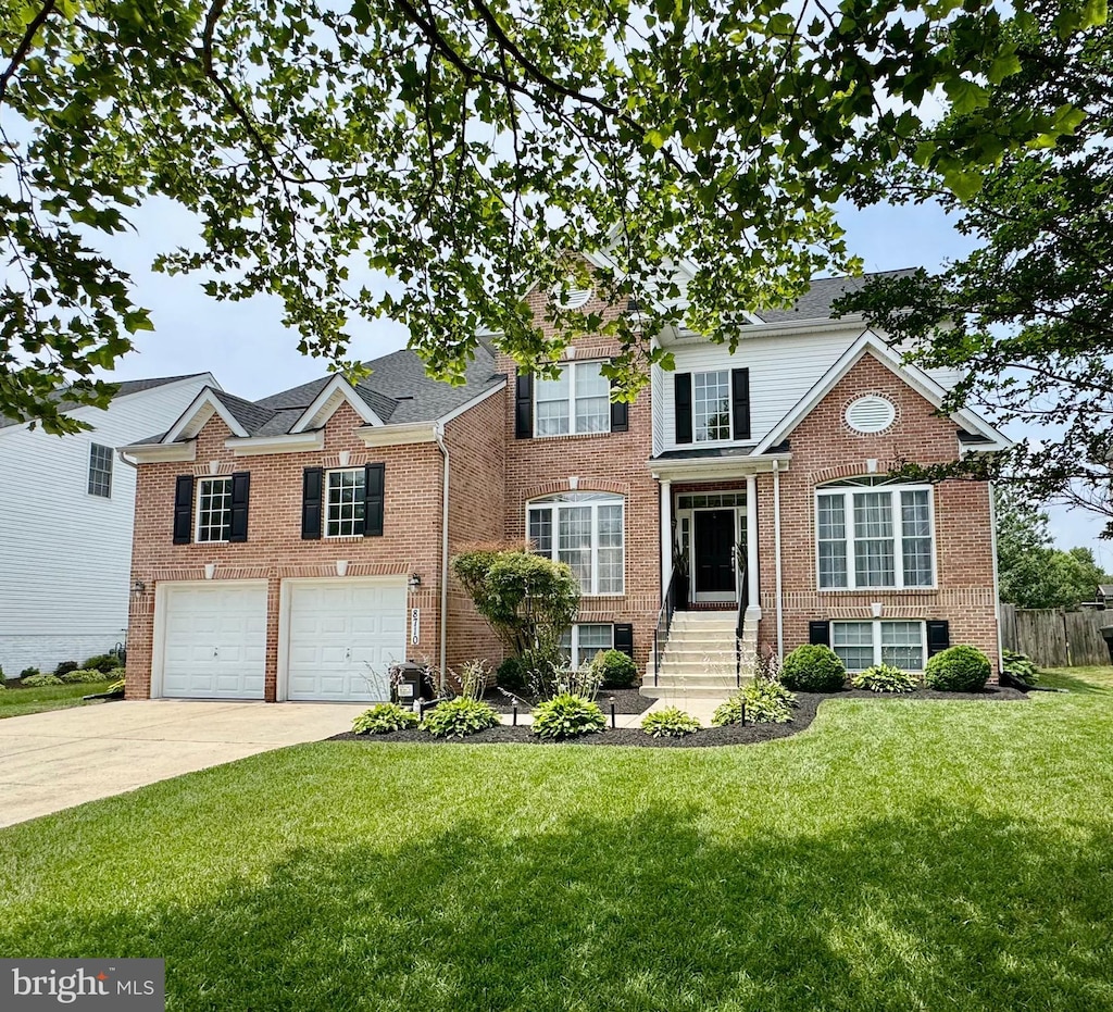 8710 Brenton Dr, Easton, MD 21601 - view of front of property featuring driveway, brick siding, and an attached garage