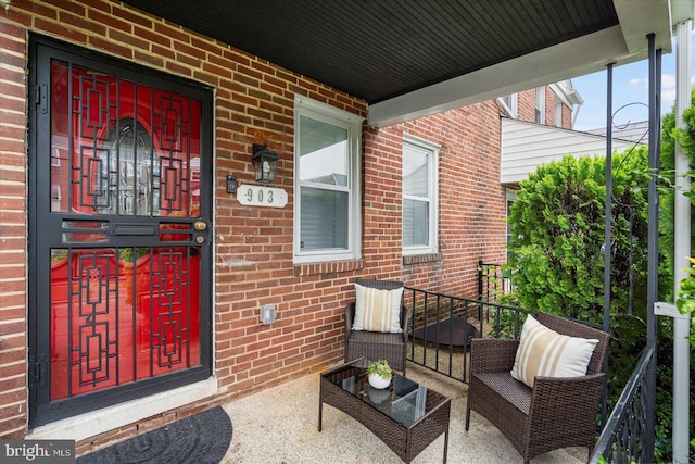 903 Mount Holly St, Baltimore, MD 21229 - entrance to property with brick siding and a porch