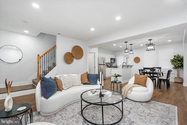 903 Mount Holly St, Baltimore, MD 21229 - living area featuring stairway, wood finished floors, and recessed lighting