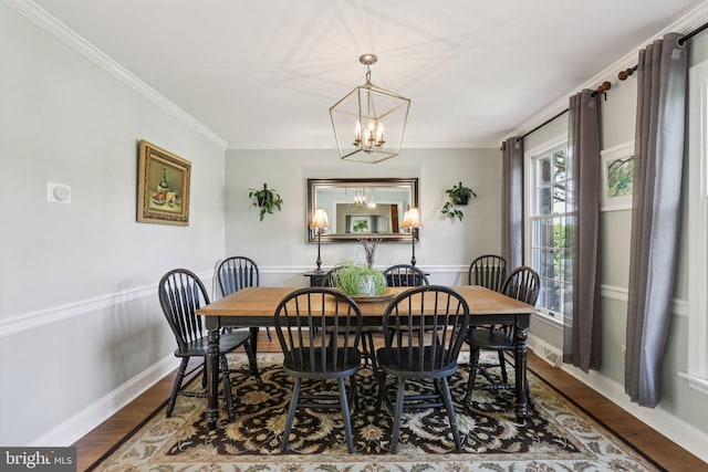 1118 Dorset Dr, West Chester, PA 19382 - dining room featuring a chandelier, wood finished floors, and crown molding