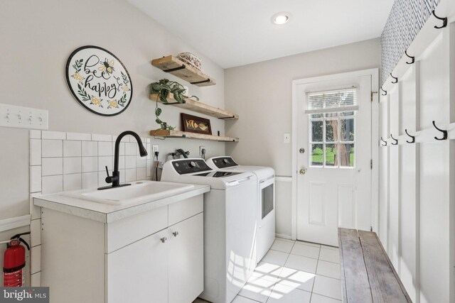 1118 Dorset Dr, West Chester, PA 19382 - laundry room featuring washer and dryer, cabinet space, and light tile patterned floors