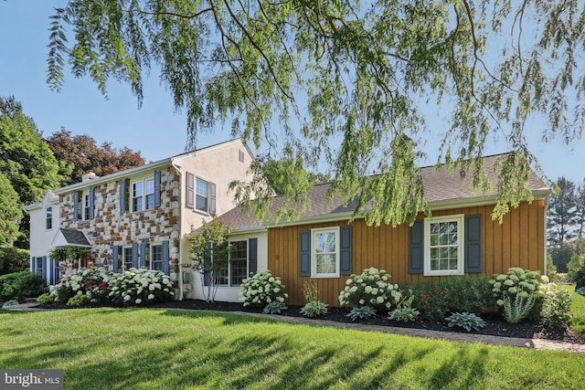 1118 Dorset Dr, West Chester, PA 19382 - view of front of house with a front yard, board and batten siding, and stone siding