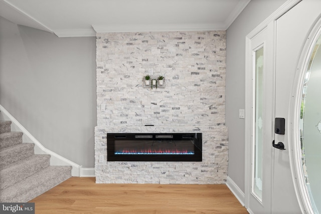 7632 Fayette St, Philadelphia, PA 19150 - detailed view of ornamental molding, wood finished floors, and a stone fireplace