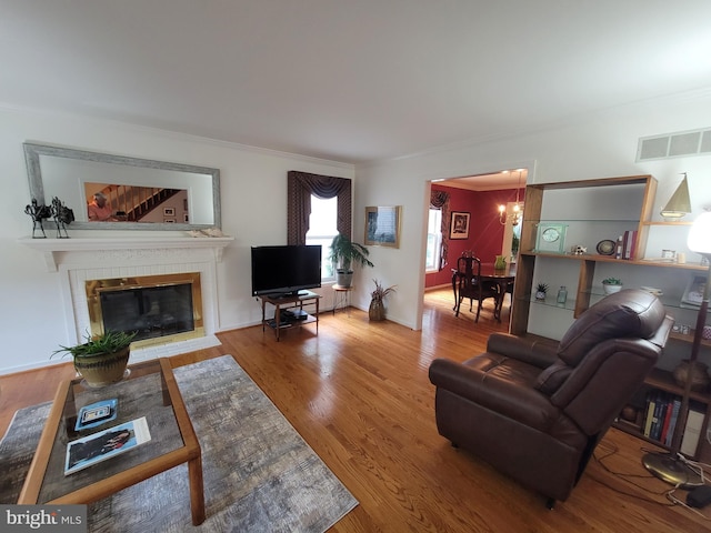 7 E Cardiff Ct, Newark, DE 19711 - living room featuring ornamental molding, a fireplace, and wood finished floors