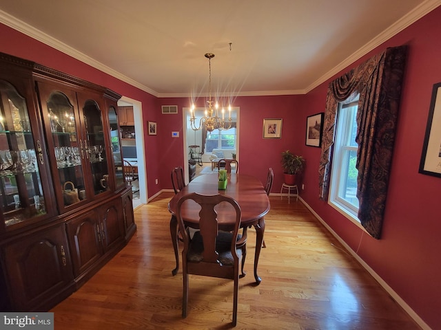 7 E Cardiff Ct, Newark, DE 19711 - dining space with a chandelier, light wood-style floors, and ornamental molding