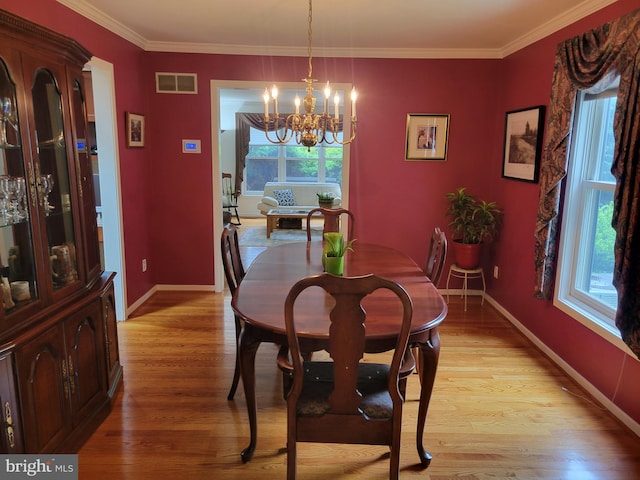 7 E Cardiff Ct, Newark, DE 19711 - dining room featuring a chandelier, light wood-type flooring, and ornamental molding