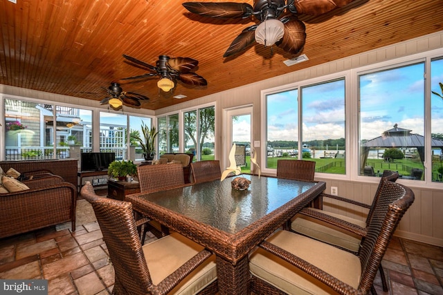644 Chester River Beach Rd, Grasonville, MD 21638 - sunroom / solarium with stone tile flooring, a ceiling fan, wooden ceiling, and outdoor dining space