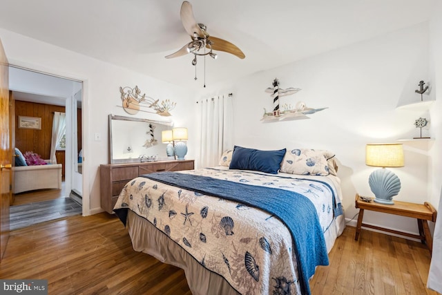 644 Chester River Beach Rd, Grasonville, MD 21638 - bedroom with wood-type flooring and ceiling fan