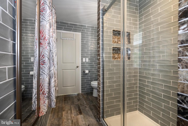 644 Chester River Beach Rd, Grasonville, MD 21638 - full bath with hardwood / wood-style floors, a stall shower, and tile walls