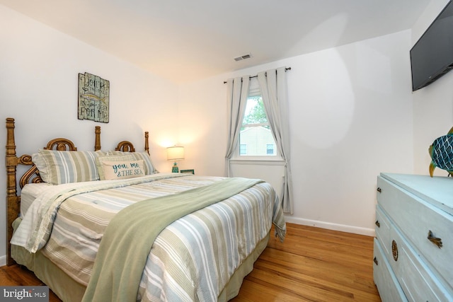 644 Chester River Beach Rd, Grasonville, MD 21638 - bedroom featuring light wood-style flooring and baseboards
