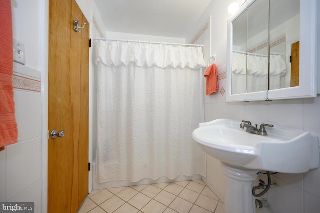 644 Chester River Beach Rd, Grasonville, MD 21638 - full bath with tile patterned flooring, shower / bath combo, and tile walls