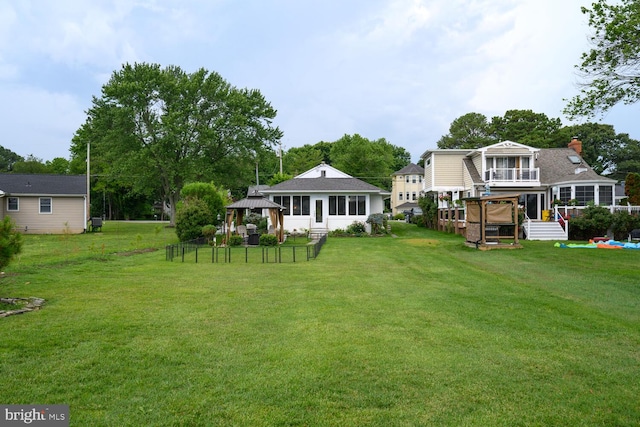 644 Chester River Beach Rd, Grasonville, MD 21638 - view of grassy yard featuring a gazebo, a sunroom, and a balcony