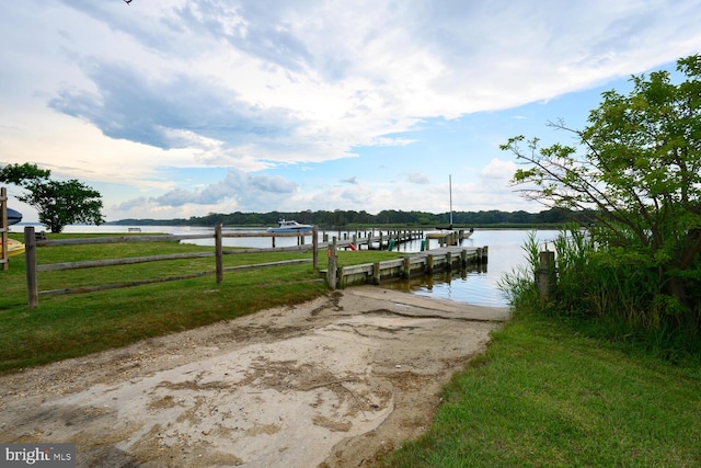 644 Chester River Beach Rd, Grasonville, MD 21638 - dock area with a boat ramp, a water view, and a lawn