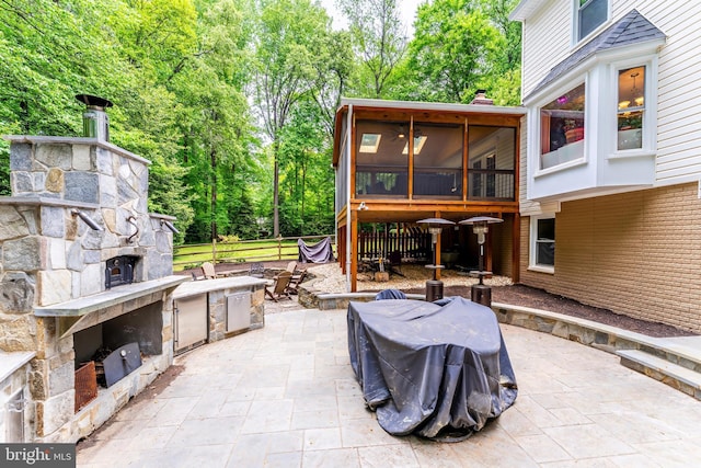 2930 Fox Mill Rd, Oak Hill, VA 20171 - view of patio featuring an outdoor stone fireplace and a sunroom