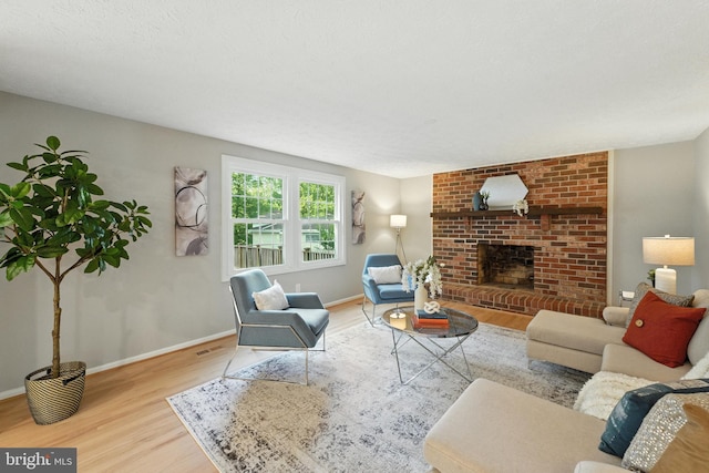 6 Ivywood Ct, Silver Spring, MD 20904 - living room featuring wood finished floors and a brick fireplace