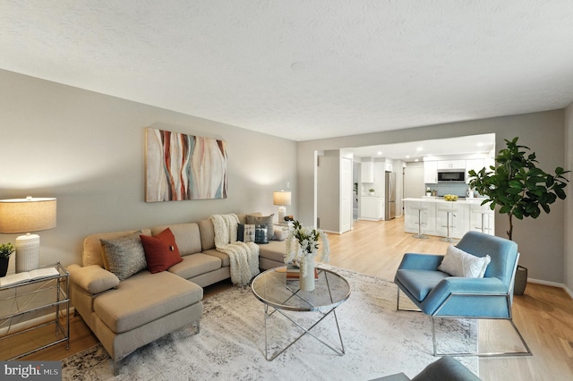 6 Ivywood Ct, Silver Spring, MD 20904 - living area featuring light wood-style floors and baseboards