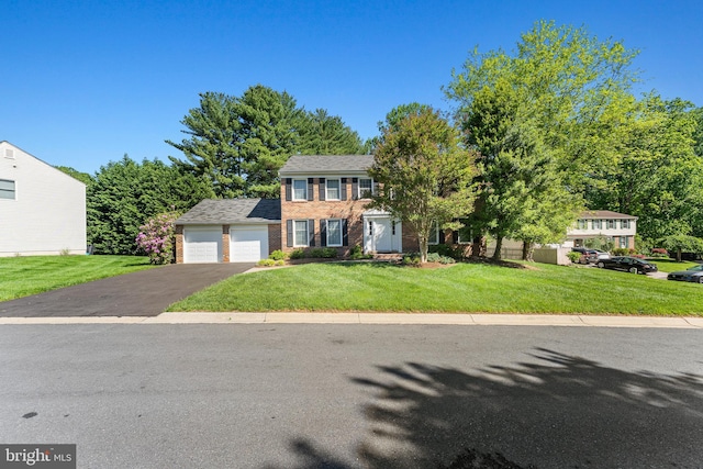 6 Ivywood Ct, Silver Spring, MD 20904 - colonial home featuring driveway, a front yard, an attached garage, and brick siding