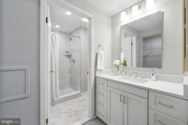 6 Ivywood Ct, Silver Spring, MD 20904 - full bathroom with a tile shower, vanity, marble finish floors, and a walk in closet