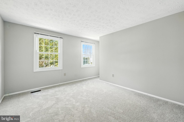 6 Ivywood Ct, Silver Spring, MD 20904 - carpeted empty room with baseboards and a textured ceiling