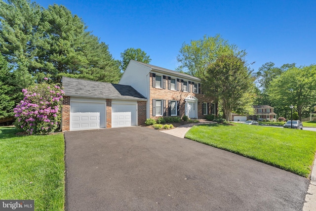 6 Ivywood Ct, Silver Spring, MD 20904 - colonial inspired home with brick siding, an attached garage, driveway, and a front lawn