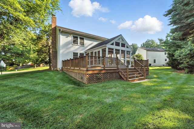 6 Ivywood Ct, Silver Spring, MD 20904 - back of property with a chimney, a sunroom, a wooden deck, and a yard