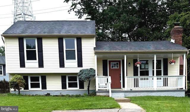 3502 Blue Coat Rd, Baltimore, MD 21236 - split level home with covered porch, a front yard, and a shingled roof