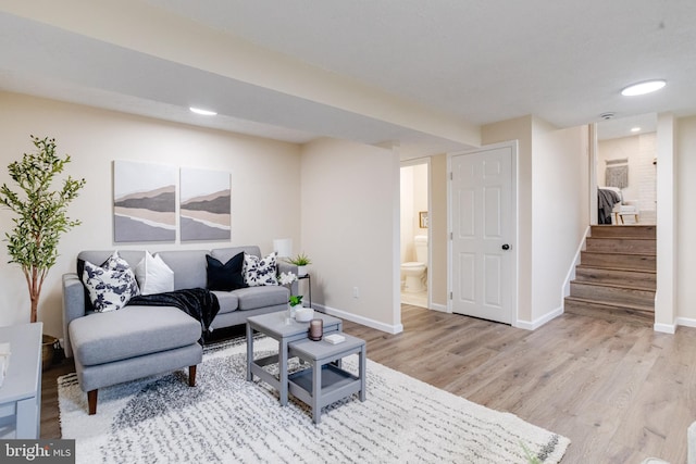 3502 Blue Coat Rd, Baltimore, MD 21236 - living area with wood finished floors, stairway, and recessed lighting