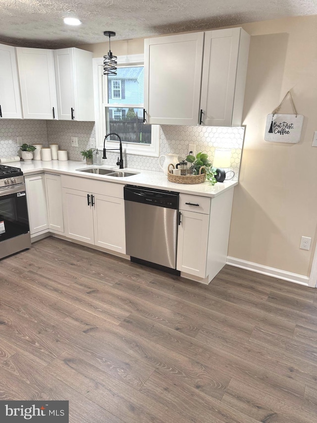 3502 Blue Coat Rd, Baltimore, MD 21236 - kitchen with appliances with stainless steel finishes, white cabinets, dark wood-type flooring, a textured ceiling, and recessed lighting