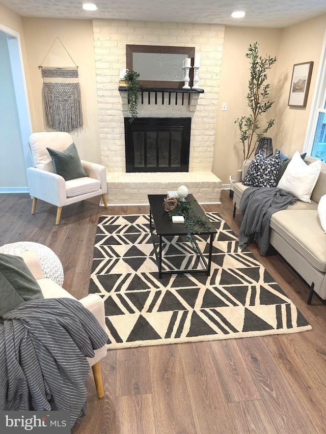 3502 Blue Coat Rd, Baltimore, MD 21236 - living area with wood finished floors, a brick fireplace, and recessed lighting