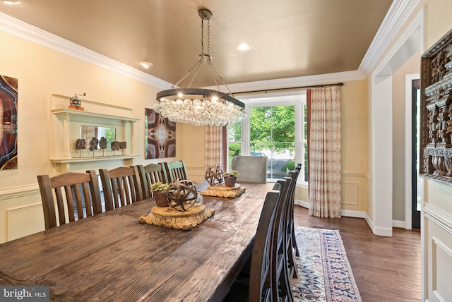 10915 Lamplighter Ln, Potomac, MD 20854 - dining area featuring a chandelier, crown molding, wood finished floors, a decorative wall, and wainscoting