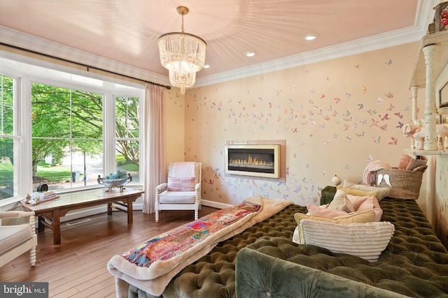 10915 Lamplighter Ln, Potomac, MD 20854 - living area with a glass covered fireplace, crown molding, wood-type flooring, wallpapered walls, and a chandelier