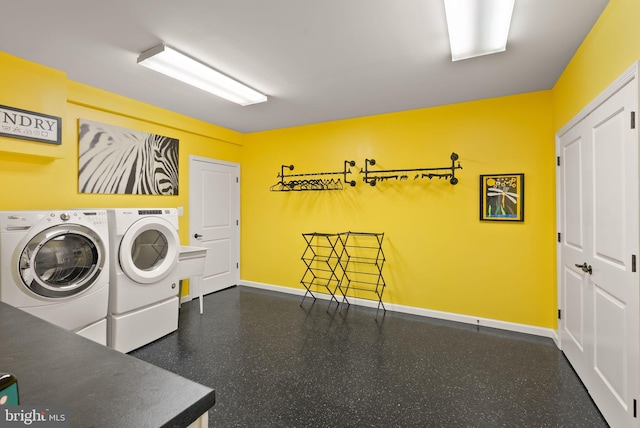 10915 Lamplighter Ln, Potomac, MD 20854 - laundry room featuring washing machine and dryer and baseboards