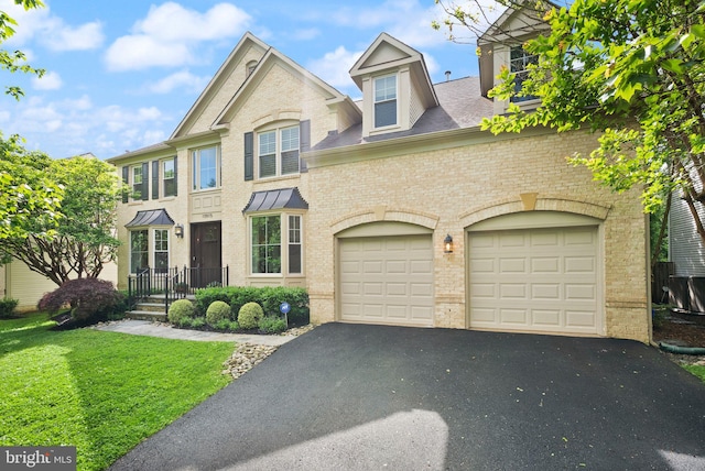 10915 Lamplighter Ln, Potomac, MD 20854 - view of front of property featuring driveway, brick siding, an attached garage, a front yard, and a shingled roof