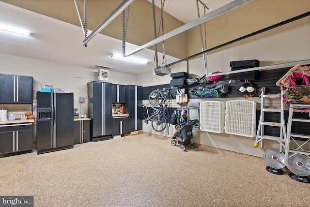10915 Lamplighter Ln, Potomac, MD 20854 - garage featuring black fridge with ice dispenser and a garage door opener