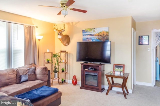 556 Hillcrest Rd, York, PA 17403 - carpeted living area with a glass covered fireplace and ceiling fan