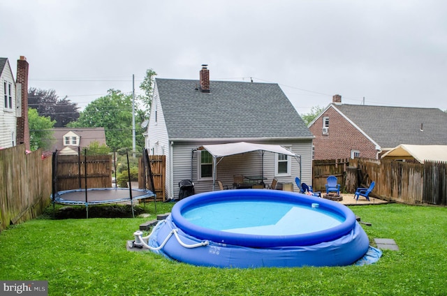 556 Hillcrest Rd, York, PA 17403 - view of swimming pool featuring a trampoline and a fenced backyard