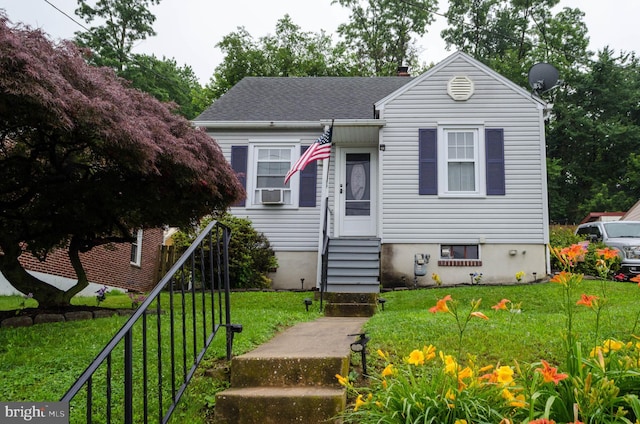 556 Hillcrest Rd, York, PA 17403 - view of front of home featuring entry steps, a front lawn, and a chimney