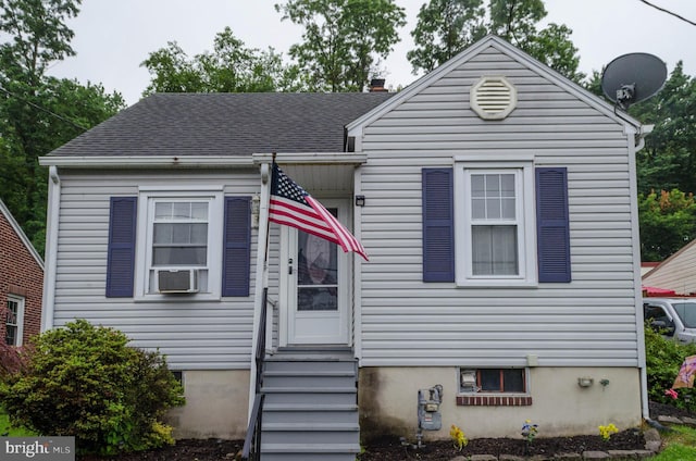 556 Hillcrest Rd, York, PA 17403 - view of front of property with entry steps, cooling unit, and a chimney
