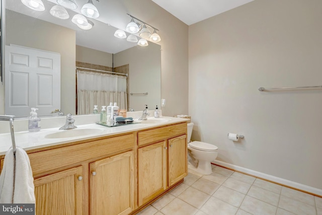 20810 Noble Ter Unit 104, Sterling, VA 20165 - full bath featuring double vanity, tile patterned flooring, and a shower with shower curtain