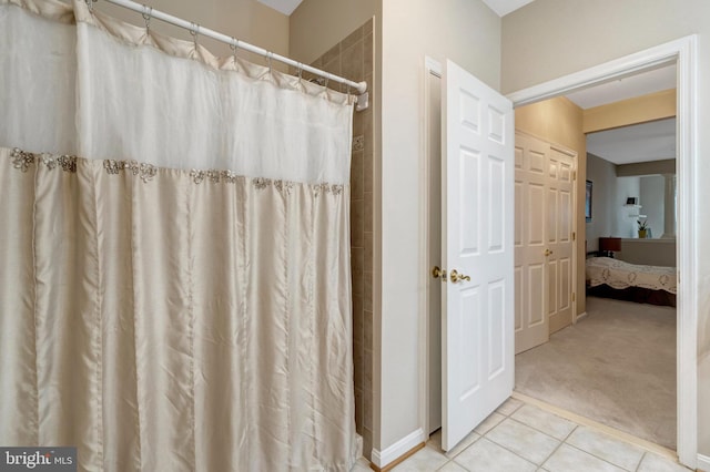 20810 Noble Ter Unit 104, Sterling, VA 20165 - bathroom featuring ensuite bathroom, tile patterned floors, and a shower with shower curtain