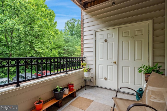 20810 Noble Ter Unit 104, Sterling, VA 20165 - doorway to property with a balcony