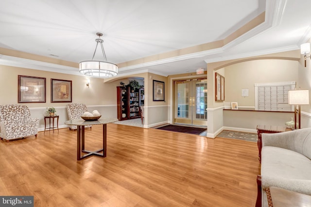 20810 Noble Ter Unit 104, Sterling, VA 20165 - living room with crown molding, wood finished floors, and a raised ceiling